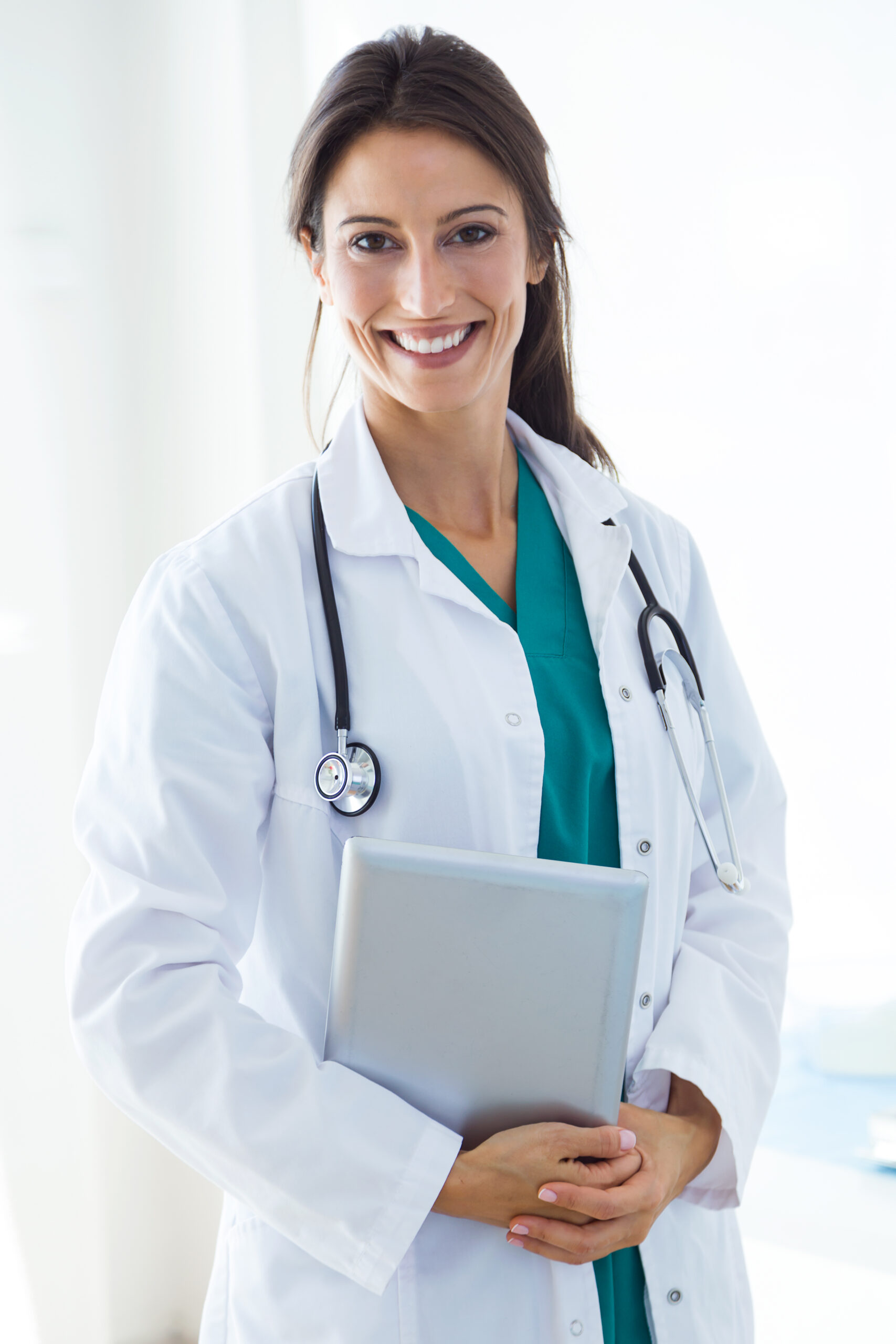 Portrait of beautiful young female doctor looking at camera in the office.